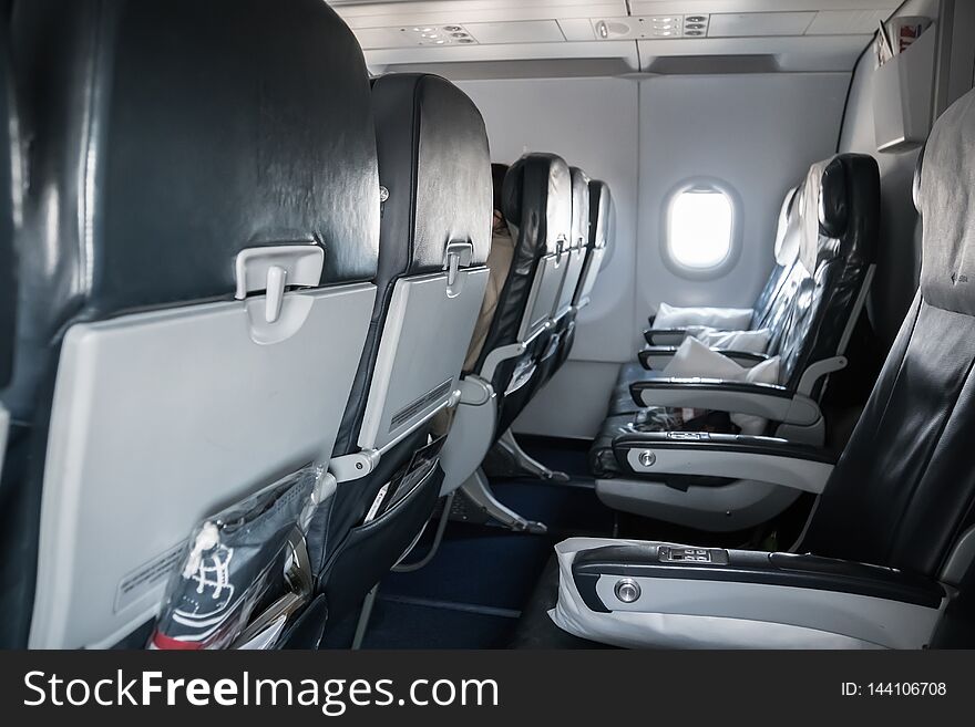 Empty airplane seats. Inside the cabin of a Boeing. Seats in economy class
