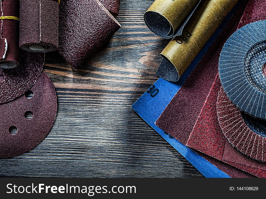 Big set of abrasive tools on vintage wood board