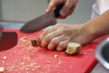 Free Man Hands Cutting Bread For Croutons On Red Cutting Doard Royalty Free Stock Photography - 144113347
