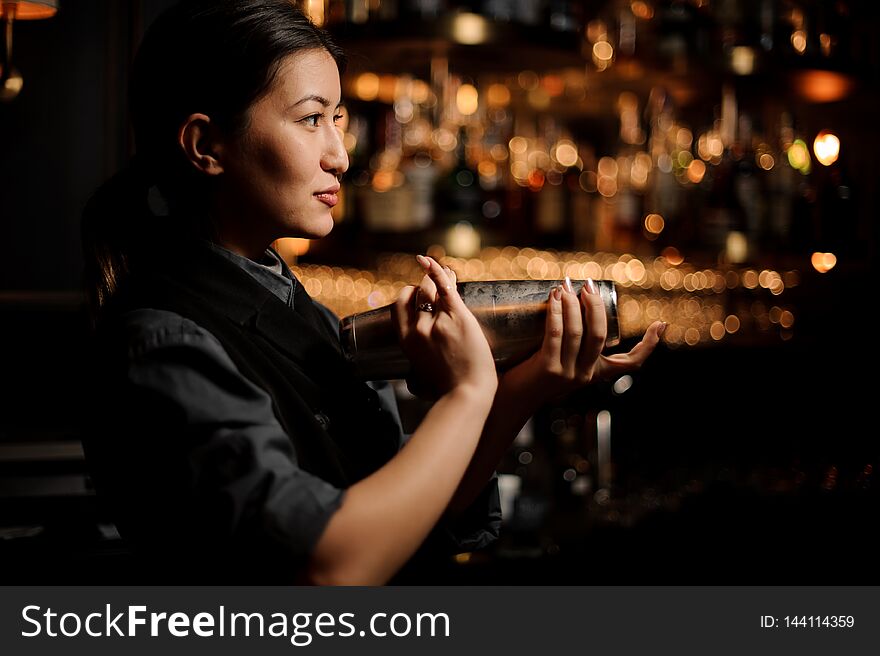 Brunette Bartender Girl Holding A Steel Shaker