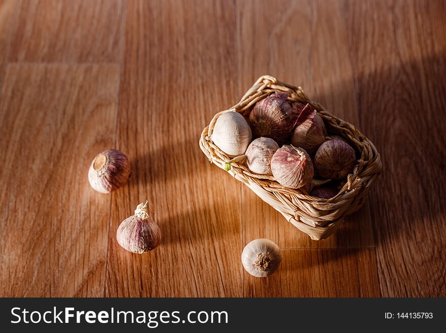 Solo Garlic With Green Sprout In Small Basket
