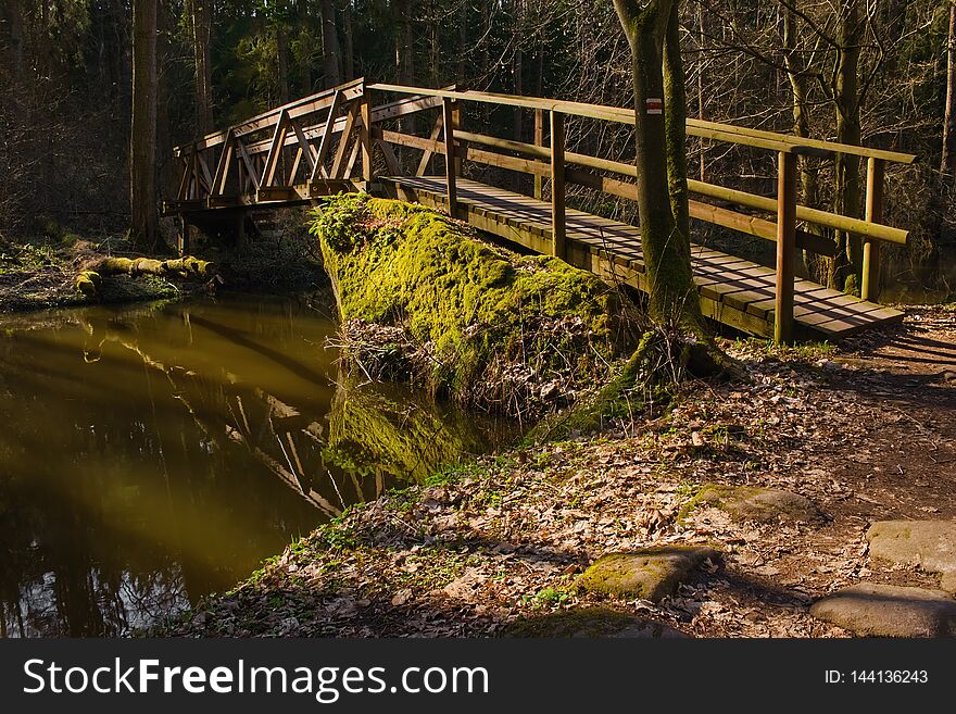 Wooden bridge in Robecske udoli valley in czech turist region Machuv kraj