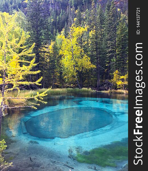 Blue geyser Lake in Altai Mountains. Siberia, Russia