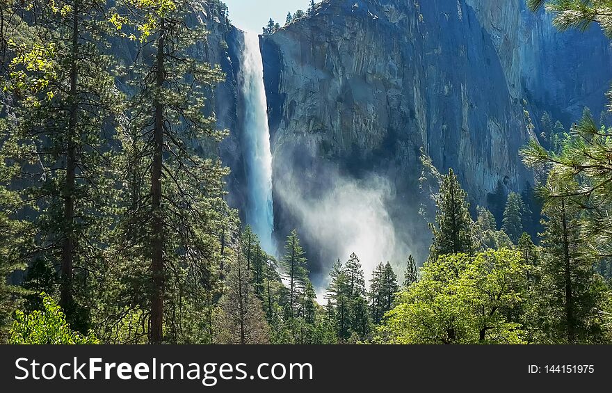 Backlit Mist Rising From Bridalveil Falls In Yosemite National Park