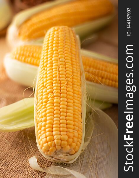 Close up shot Fresh ripe and peeled sweet corn high vitamin nature food on the table