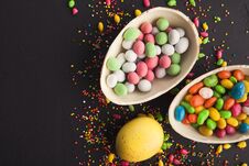 Chocolate Eggs And Colorful Candies Stock Photos
