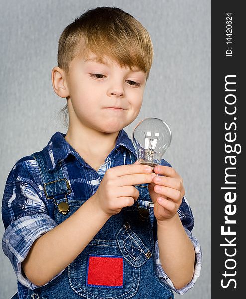 Little boy with electro light bulb. Little boy with electro light bulb
