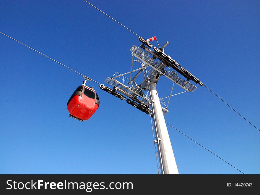 Winter landscape with a red cable car. Winter landscape with a red cable car