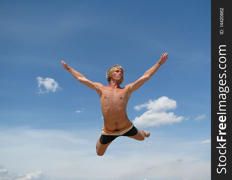 A man jumping into the sky. A man jumping into the sky