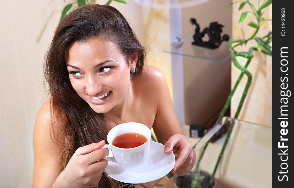 Young woman with a cup of hot drink. Young woman with a cup of hot drink