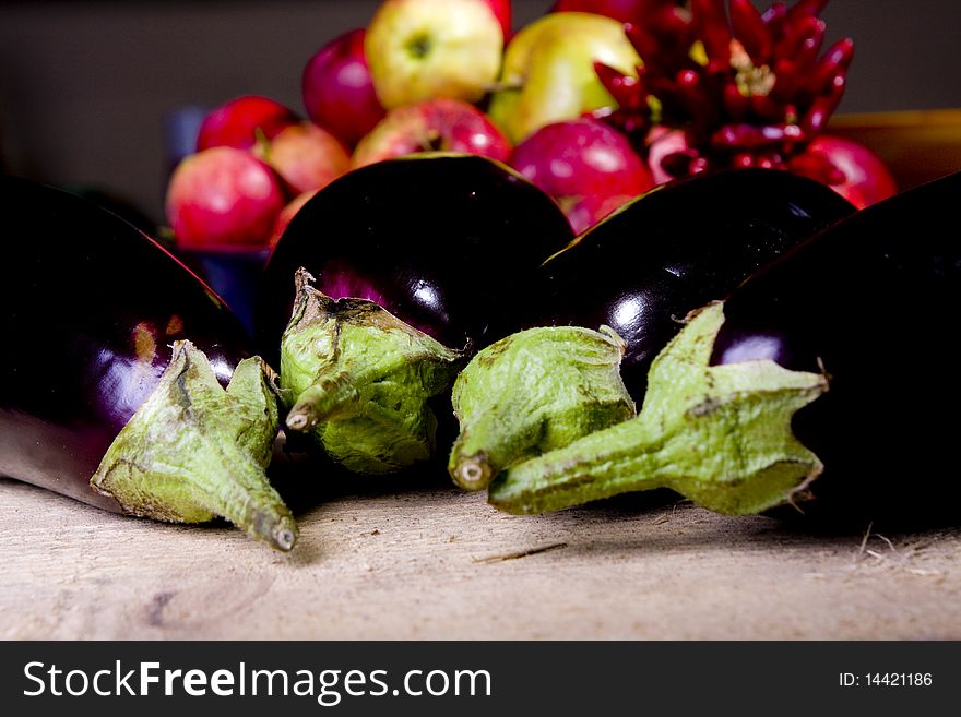 Aubergine on raw wood in the kitchen