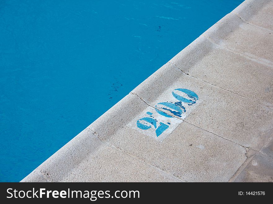 Sign indicating the depth of the swimming pool. Sign indicating the depth of the swimming pool