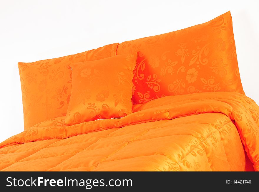 Floral orange bed spreads with soft pillows. Floral orange bed spreads with soft pillows.