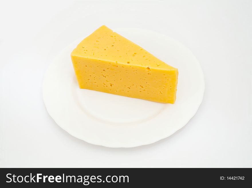 An image of a piece of yellow cheese