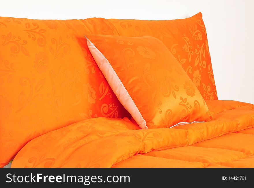 Floral orange bed spreads with soft pillows. Floral orange bed spreads with soft pillows.