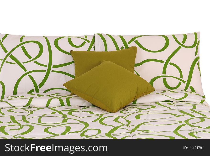 Green and white bed spreads with soft pillows. Green and white bed spreads with soft pillows.