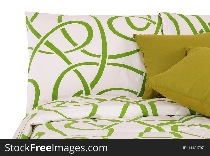 Green and white bed spreads with soft pillows. Green and white bed spreads with soft pillows.