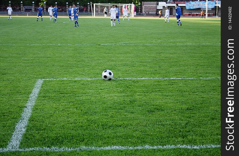 The ball on the soccer field with natural turf