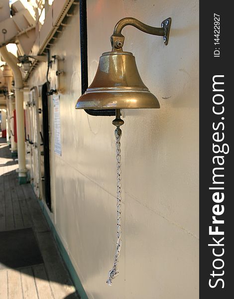 Metal bell with hemp on a ship