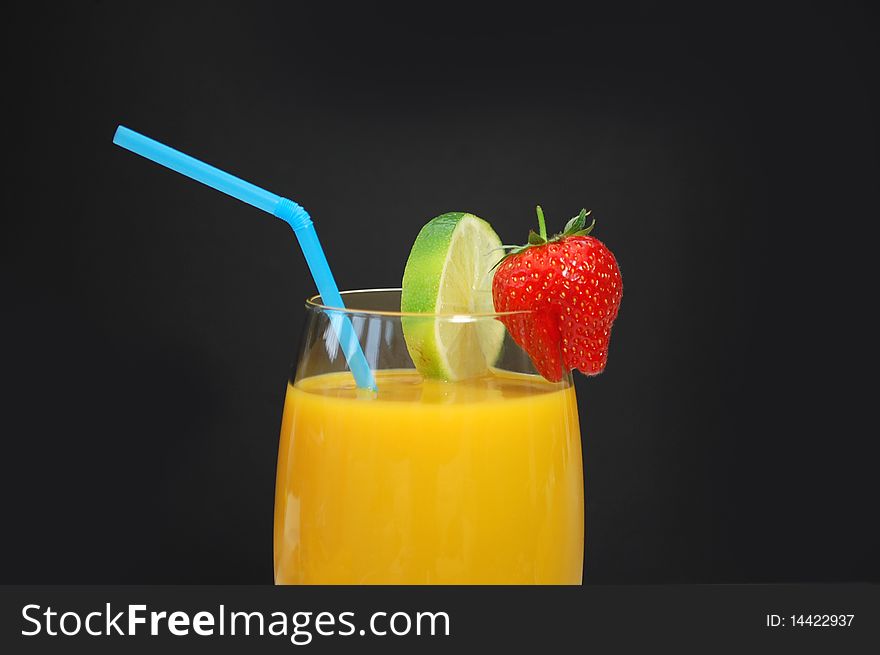 Mango smoothi in a glass with a straw. Mango smoothi in a glass with a straw