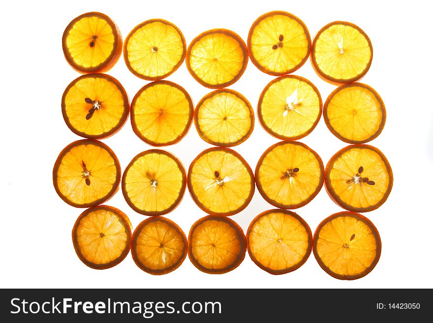 Cut segments of an orange on a white background. Cut segments of an orange on a white background.