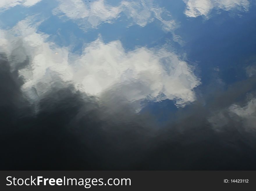 Wavy background, pattern of clouds on a water table