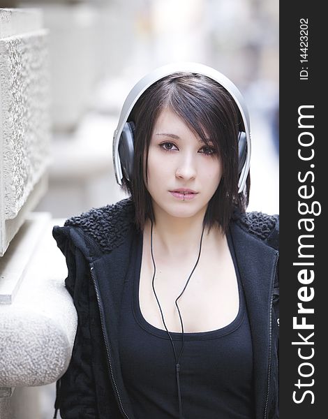 Young beautiful pierced girl with headphones. Young beautiful pierced girl with headphones.