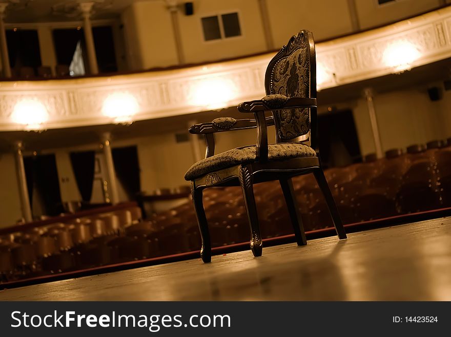 Armchair on a stage. Interior of a theatre hall