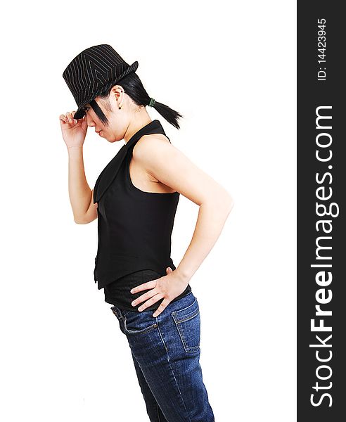 A young Asian woman with an back hat and west und jeans with short black hair, leaning forward and holding her hat, for white background. A young Asian woman with an back hat and west und jeans with short black hair, leaning forward and holding her hat, for white background.