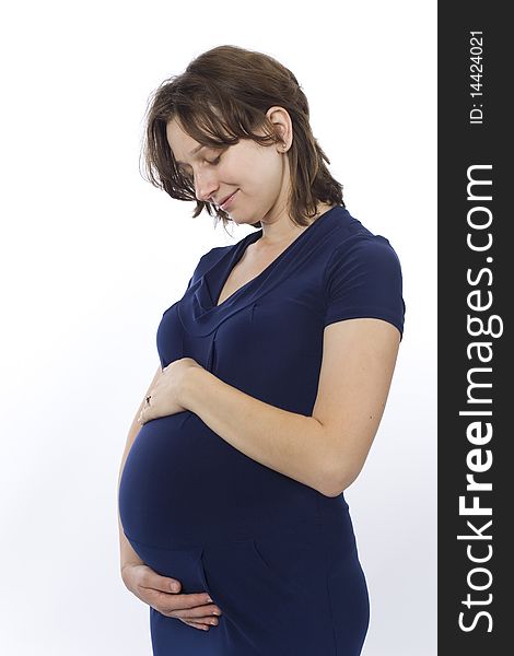 Beautiful pregnant young woman in a blue dress. Beautiful pregnant young woman in a blue dress