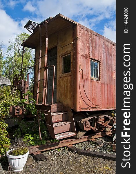 An old red caboose converted into a home