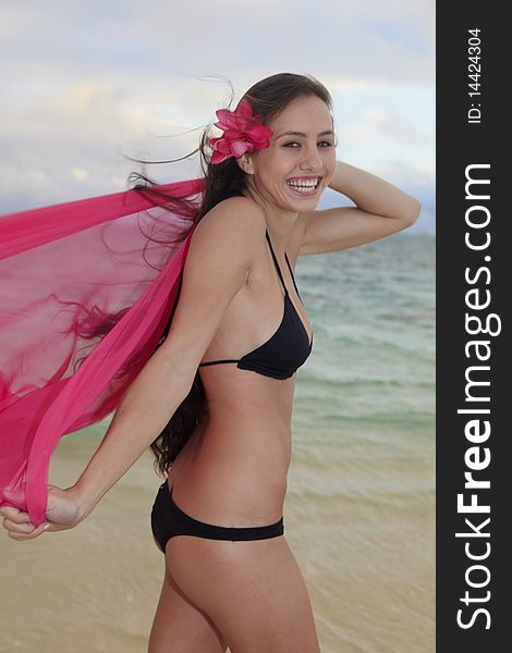 Woman on lanikai beach at sunrise