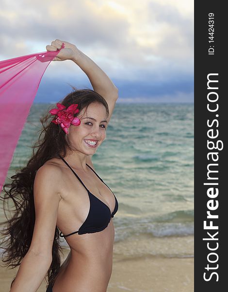 Woman on lanikai beach at sunrise