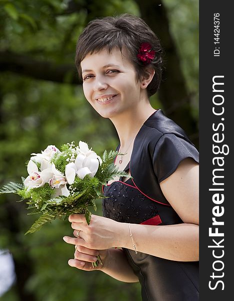 Portrait of beautiful young woman with bouquet