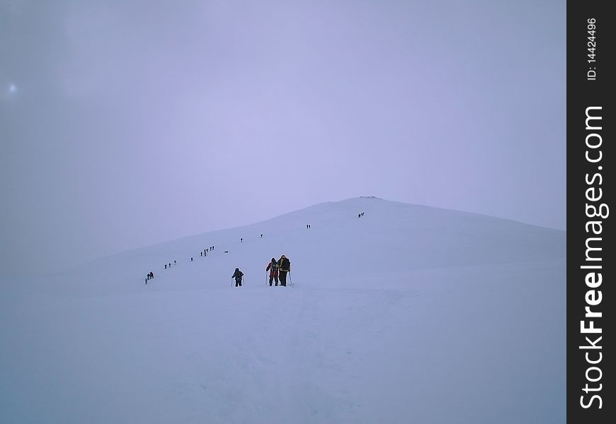 Climbing cazzola peak with snowshoe