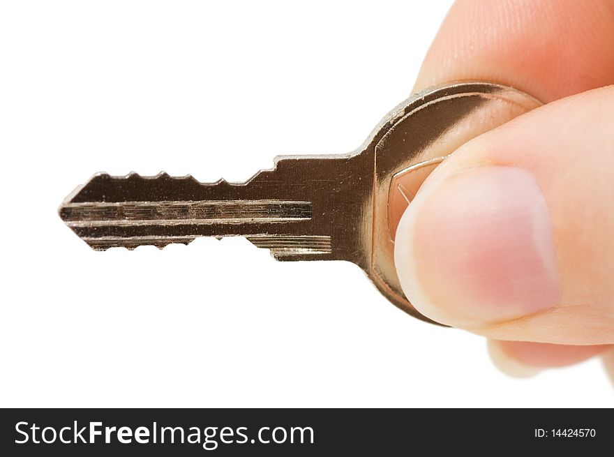 Key in a hand isolated on white background. Key in a hand isolated on white background