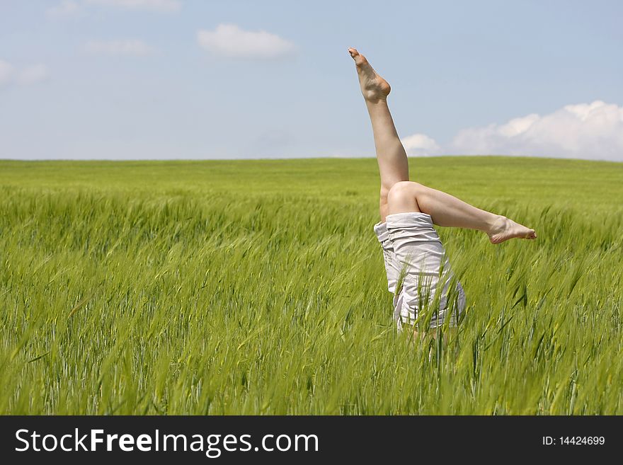 Legs Raised Up From Green Grass