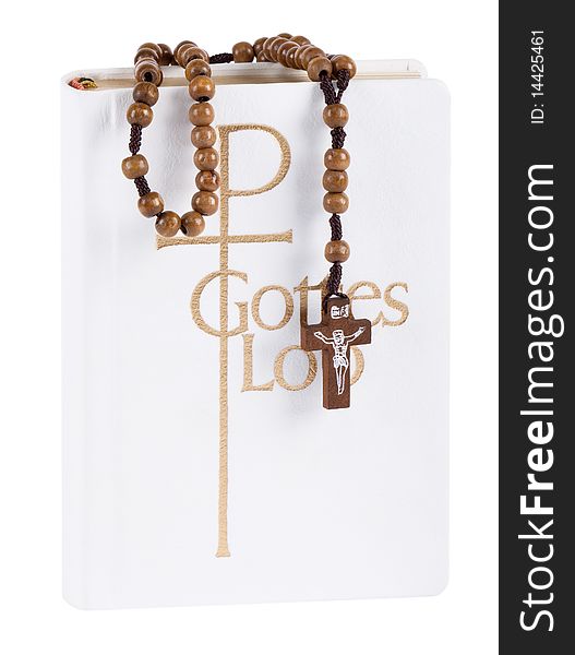 Bible with rosary in front of white background