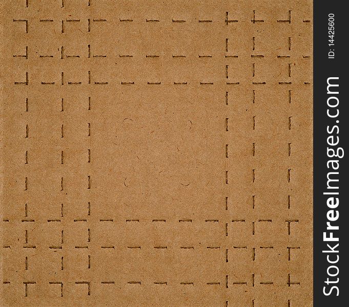 Flat brown cardboard  background texture with perforated lines that will help the box fold. Flat brown cardboard  background texture with perforated lines that will help the box fold.