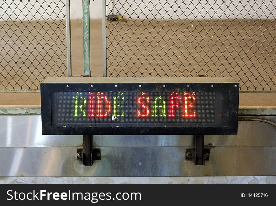 RIDE SAFE sign at a grungy looking subway entrance