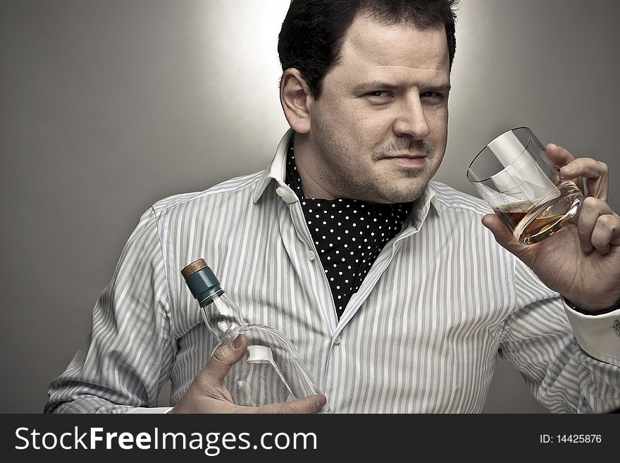 Handsome Man With A Glass Of Cognac