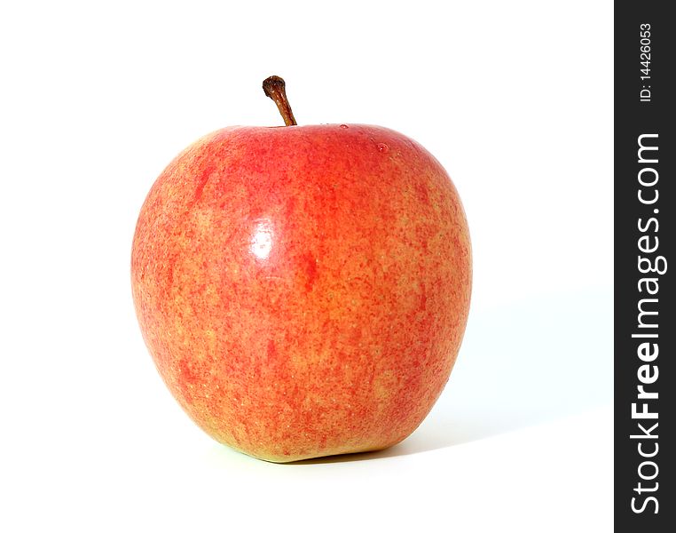 Single red apple with shadow isolated over white