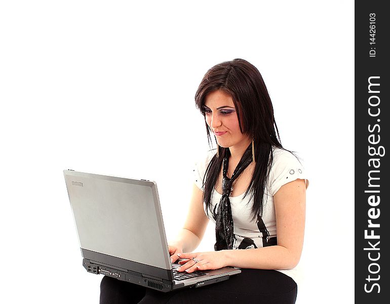 Girl working on a laptop isolated on white background