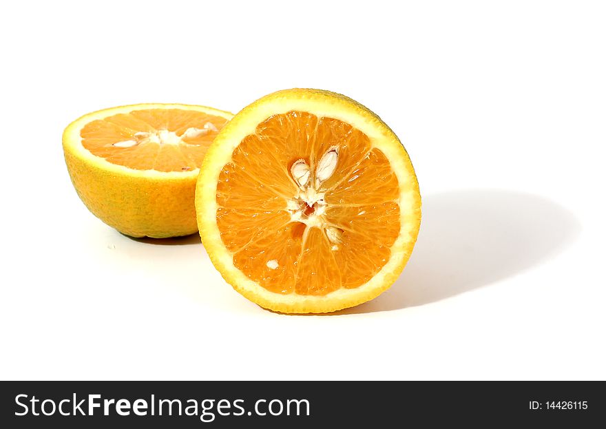 Two pieces of orange with shadow isolated over white