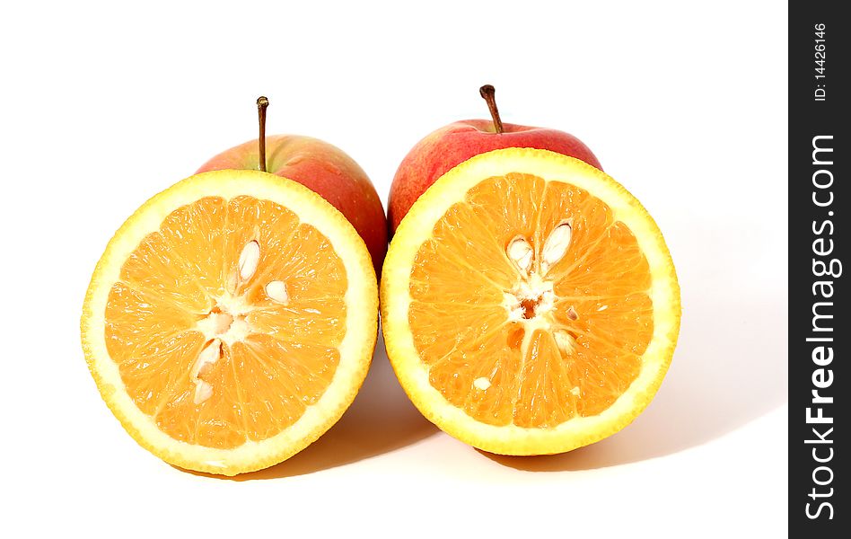 Two pieces of orange and two red apples with shadow isolated over white