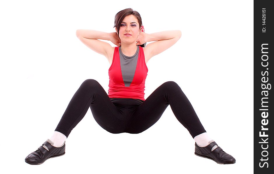 Pretty young girl in the gymnastic pose isolated on white background