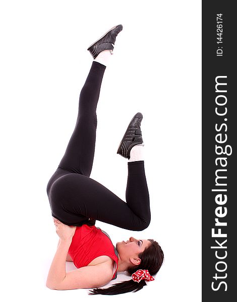 Pretty young girl in the gymnastic pose isolated on white background