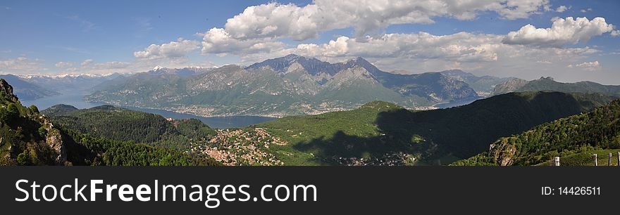 A view of the Lake of Como from a mountain pass. You can see the point that separate the lake on the left and the alps in the background. A view of the Lake of Como from a mountain pass. You can see the point that separate the lake on the left and the alps in the background