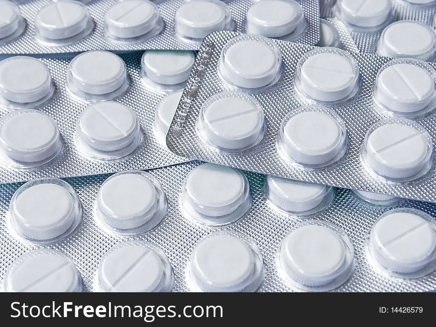 Batch of blisters with white round tablets. Batch of blisters with white round tablets