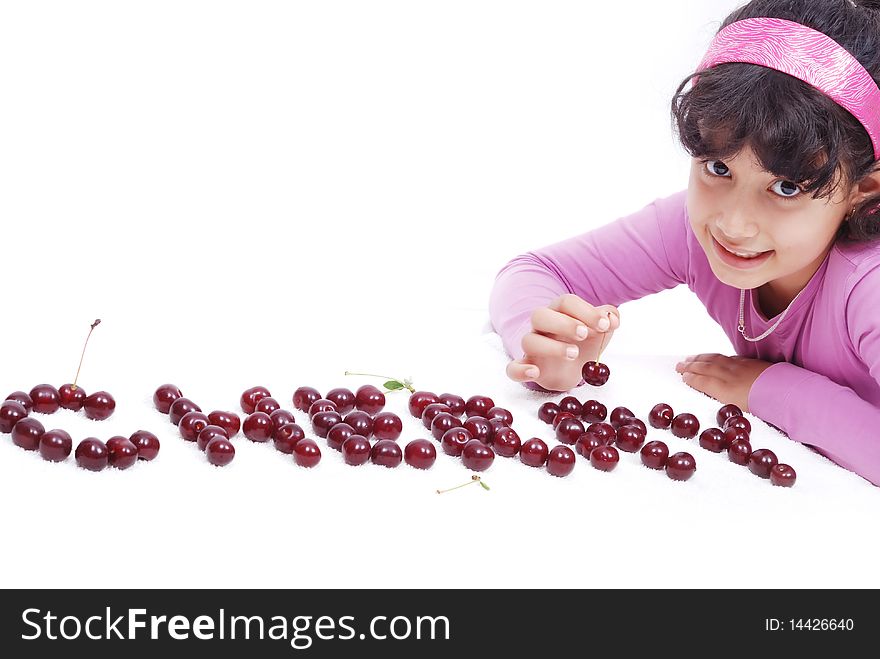 Beautiful little kid with cherry